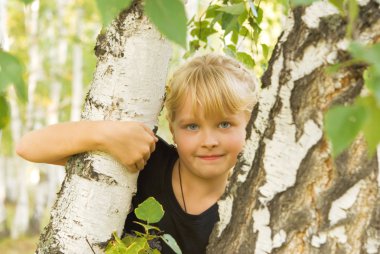 Portrait of a girl near birch clipart