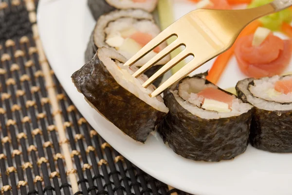 Sushi em um garfo — Fotografia de Stock