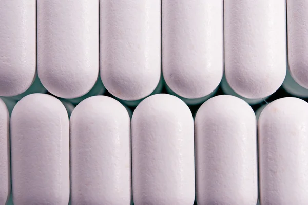 Closeup růžové pilulky — Stock fotografie
