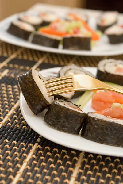Sushi em um garfo — Fotografia de Stock