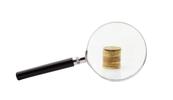 Coins increased magnifying glass — Stock Photo, Image