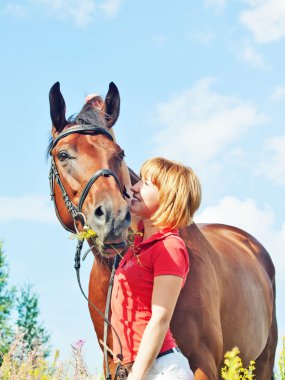 Young pretty girl with her horse clipart