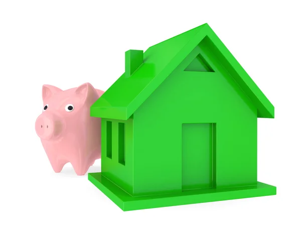 Piggy bank en groen huis. — Stockfoto