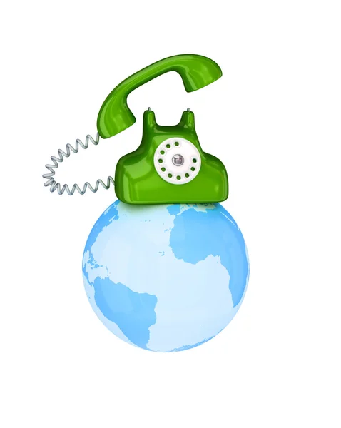 Green retro telephone on a globe — Stock Photo, Image