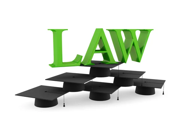Lawyer's hats and green word LAW. — Stock Photo, Image