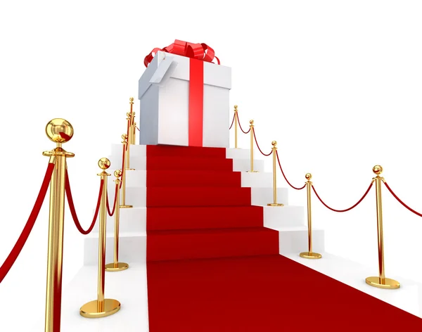 Červený koberec na schody a dárkový box. — Stock fotografie