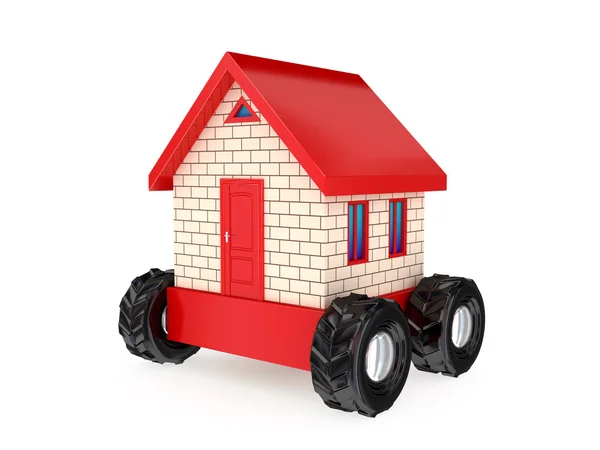 Small house on a big black wheels. — Stock Photo, Image