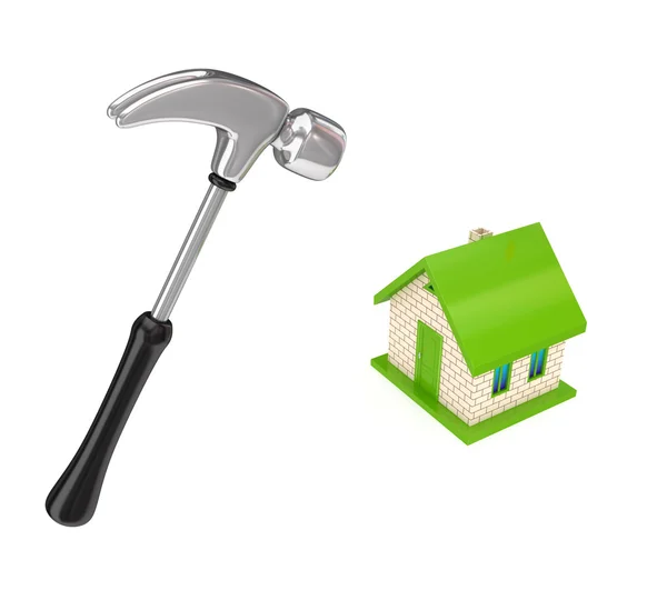 Chromed hammer and small house. — Stock Photo, Image