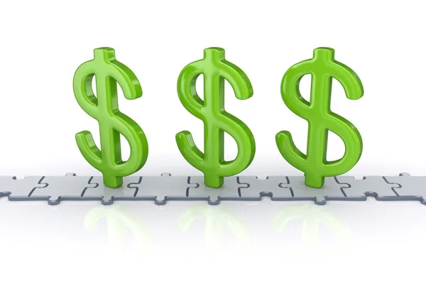 Dollar signs standing on puzzles. — Stock Photo, Image
