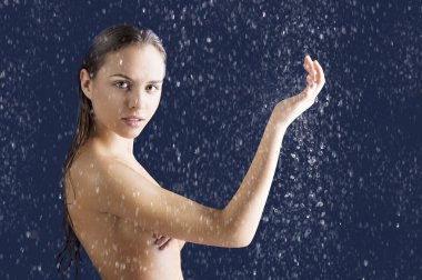 Beauty girl with wet skin with raised arm clipart