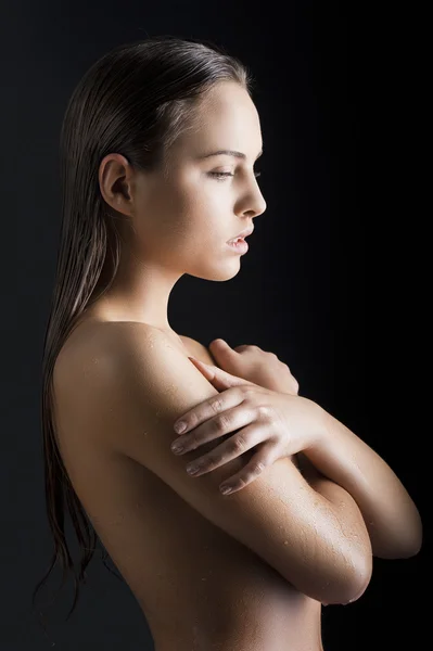 Beauty girl with wet skin turned in profile — Stock Photo, Image