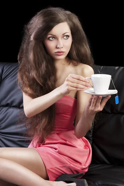 Sophisticated lady drinkig tea, she take a cup of tea with both — Stock Photo, Image