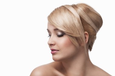 Blond young girl with stylish, she's almost turned in profile clipart