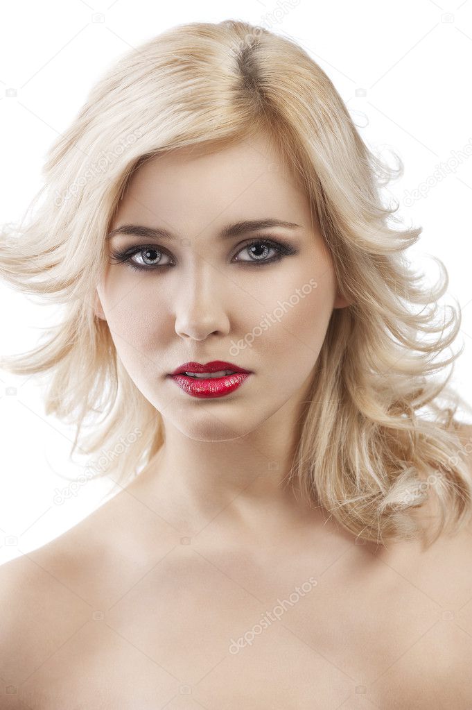 Flying hair blond girl, she smiles in front of the camera