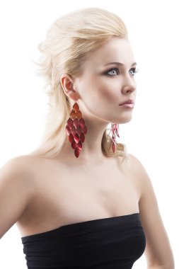 Red earring on cute blond girl, she has searious expression clipart