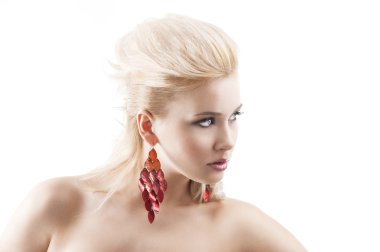 Red earring on cute blond girl, in front of the camera with a he clipart