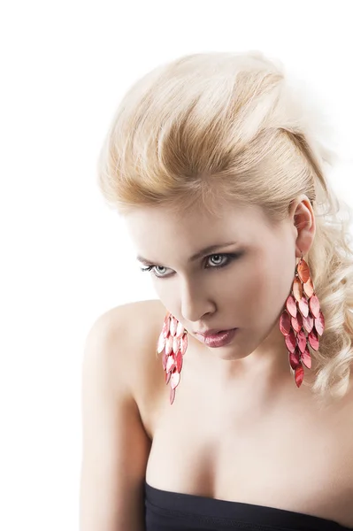 Red earring on cute blond girl, bent head and actractive express — Stock Photo, Image