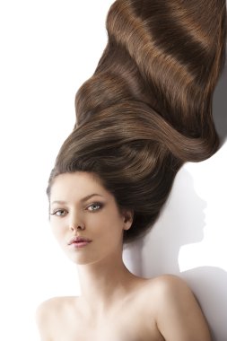 Beauty young girl hairstyle, her face is sligtly torned at right clipart