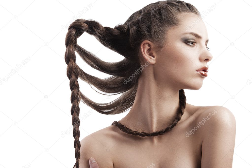 Beauty portrait of a beautiful brunette with a braid