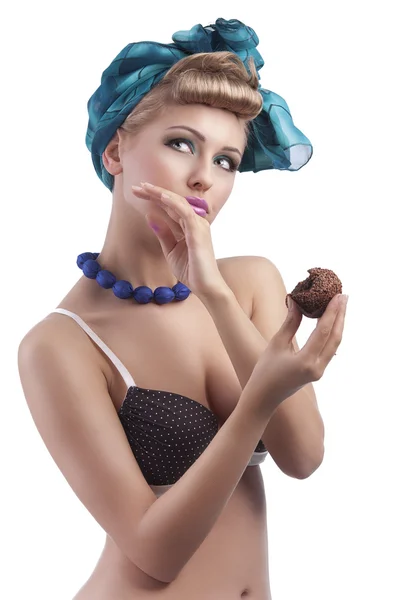 Blond young girl eating sweet — Stock Photo, Image
