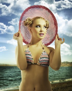 Blond girl wearing pink summer hat clipart