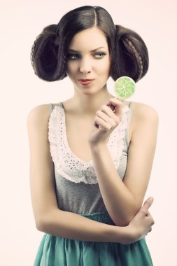 Vintage girl with lollipop, she looks the lollipop clipart