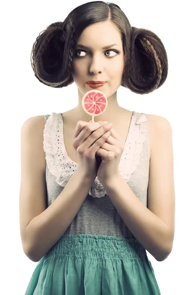 Vintage girl with lollipop, she looks at right — Stock Photo, Image