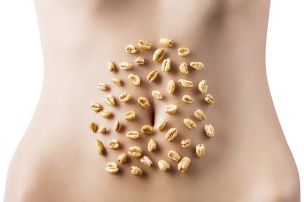 Zusammensetzung von Getreide über dem Bauch — Stockfoto