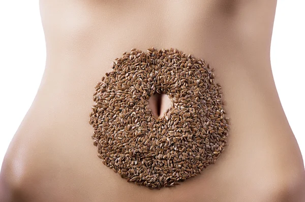 Composition of cereals over belly — Stock Photo, Image