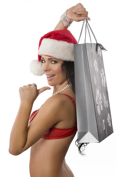 Sexy santa claus showing bag — Stock Photo, Image