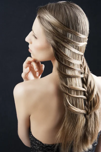 Long hair and fashion hairstyle, her hand is near the chin — Stock Photo, Image