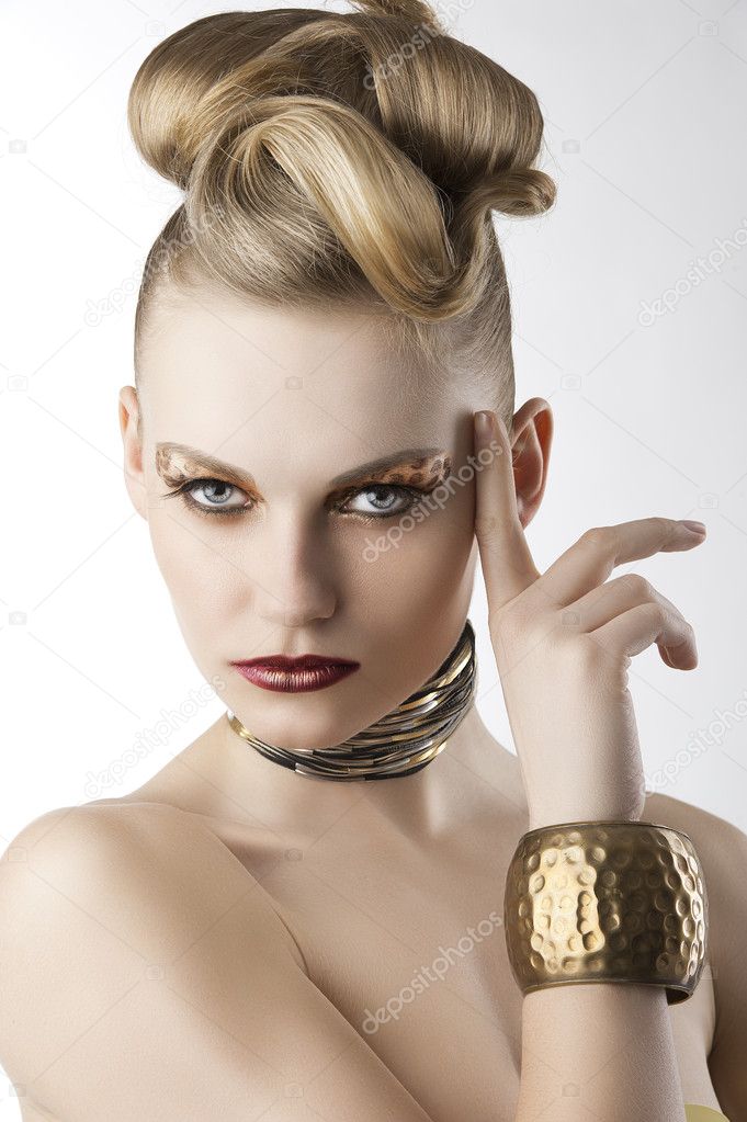 Fashion girl with leopard makeup with finger near the face