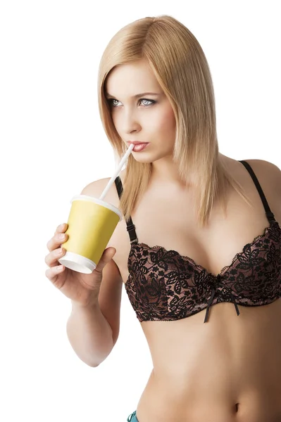 Drinking girl in lingerie, she looks at right — Stock Photo, Image