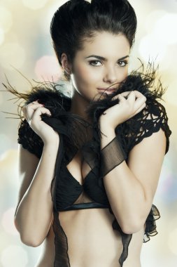 The sexy lady in black feather underwear clipart