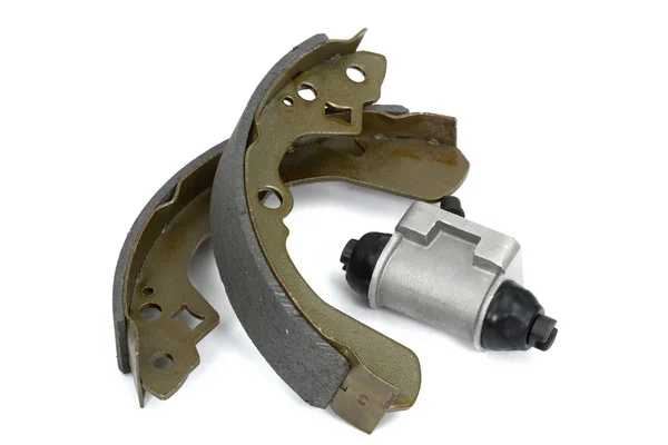 stock image New brake pads and cylinder brake drum (isolated)