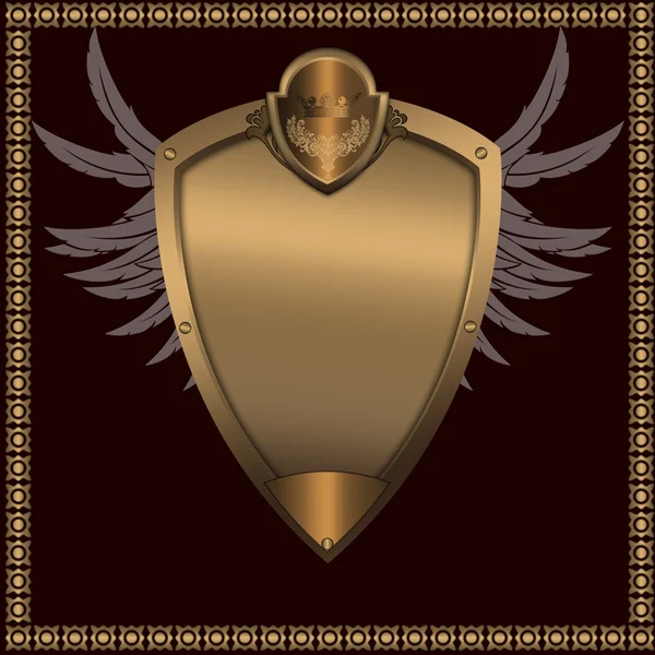 Guld shield med vingar. — Stockfoto