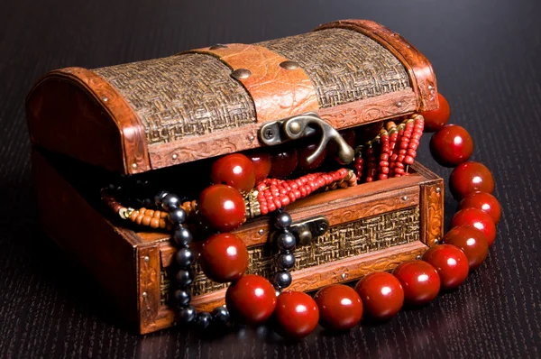 stock image Old jewelery chest with necklaces