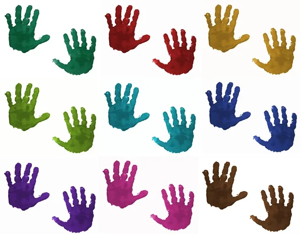 Las manos coloridas infantiles Imagen de archivo