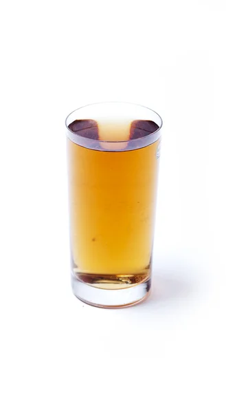 stock image Glass with orange water