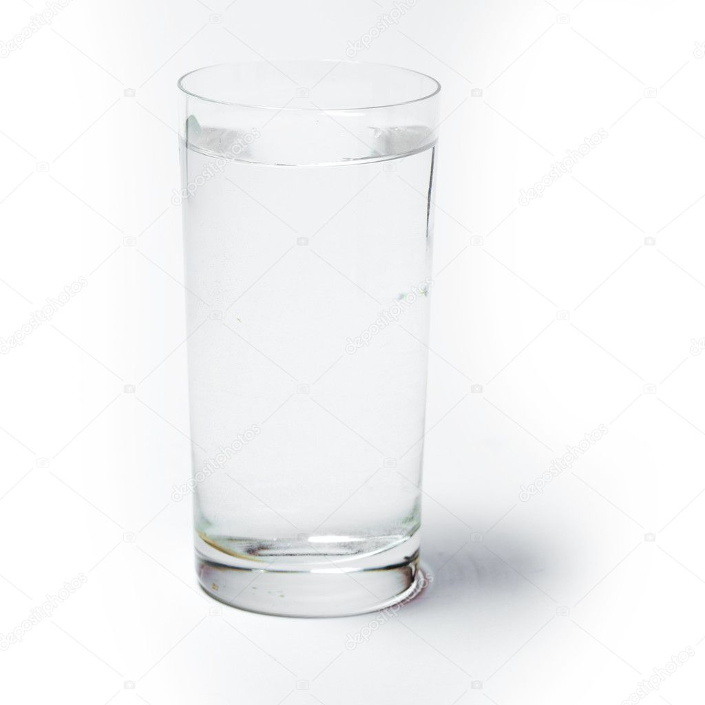 Clear Glass Of Water On A White Background Stock Photo - Download