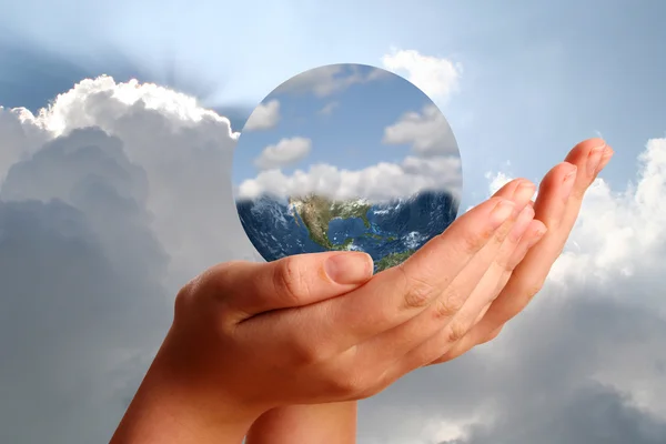 The world in young womans hands — Stock Photo, Image