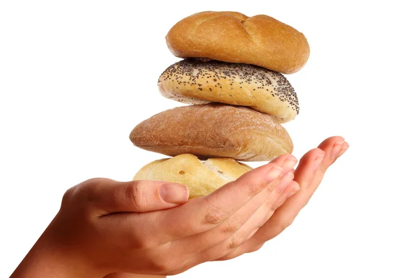 Two young hands offering a pile of buns — Stock Photo, Image