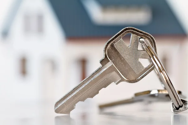 Schlüssel und Haus Stockfoto
