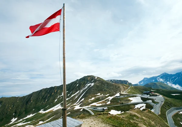 stock image Austrian Flag above Alps mountain