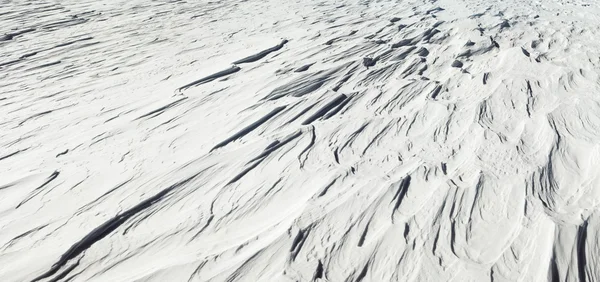 Zaspy śnieżne wiatr powstały tekstura — Zdjęcie stockowe