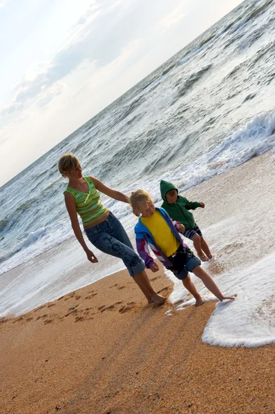 Family on surf beach Stock Photo