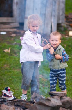 Children near campfire clipart