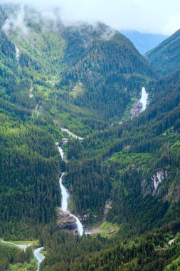 Alps waterfall summer view clipart