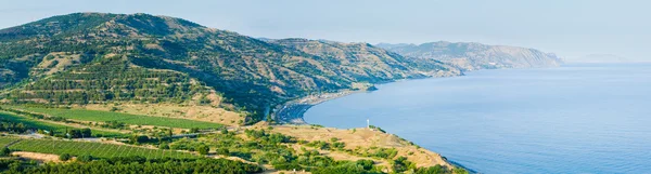 Summer coastline and camping on beach.