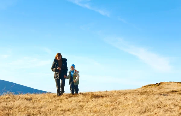 Family walk on autumn mountain plateau — Stock Photo, Image
